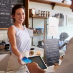 A customer making payment on a Chip and Pin device.