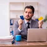 Businessman looking at credit cards