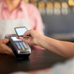 A customer using a POS machine in a store