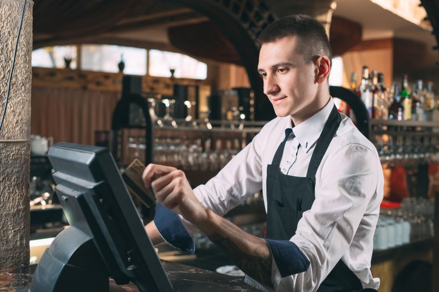 A cashier using a Web-based POS system