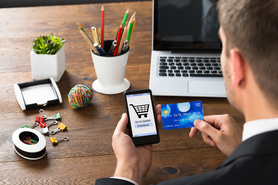 A businessman making an online order on his smartphone