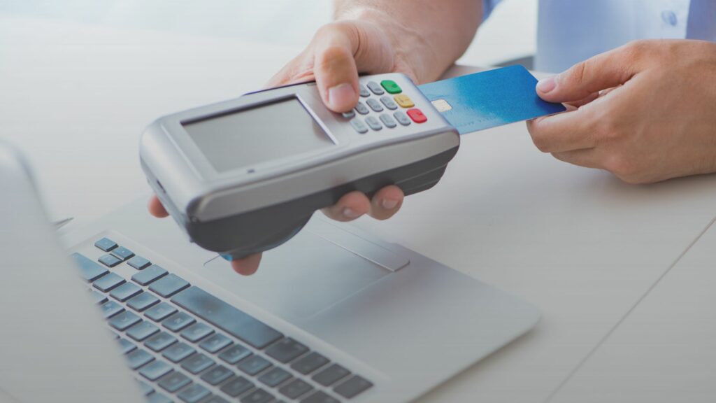 Man Processing Credit Card Transaction