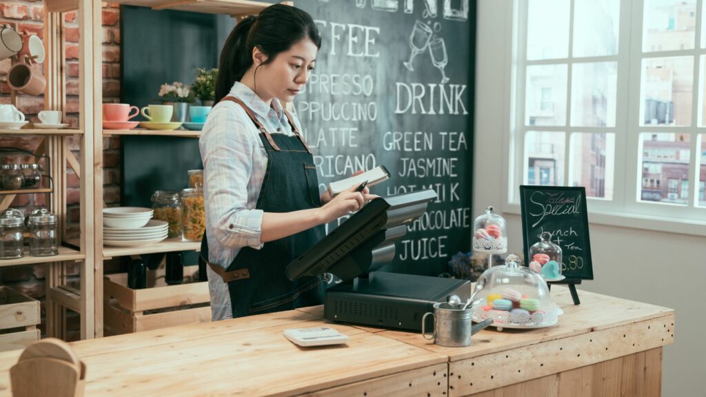 Waitress Using the Cash Register