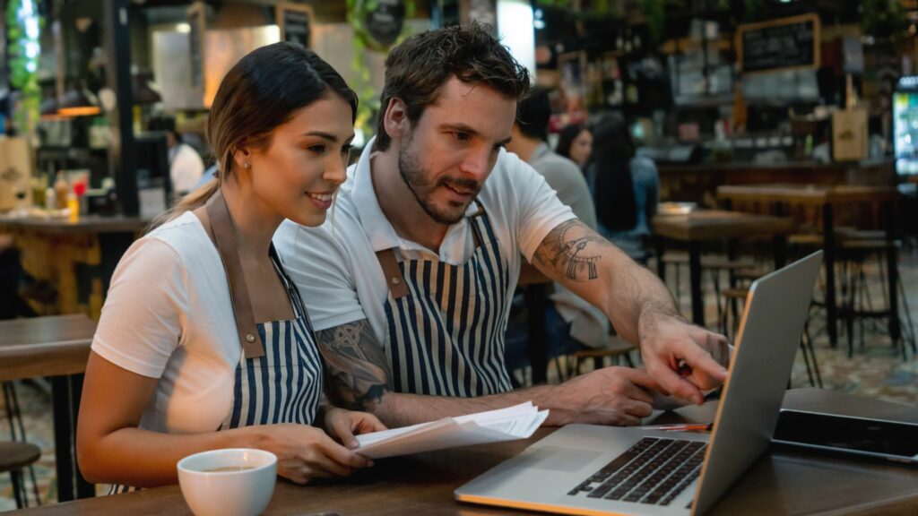 Staff working at a restaurant managing the finances