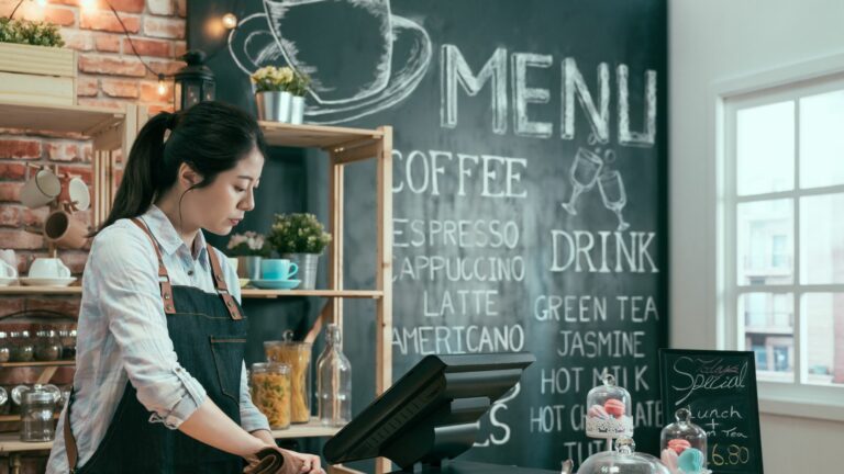 Cafe Waitress Wiping the Cashier Counter