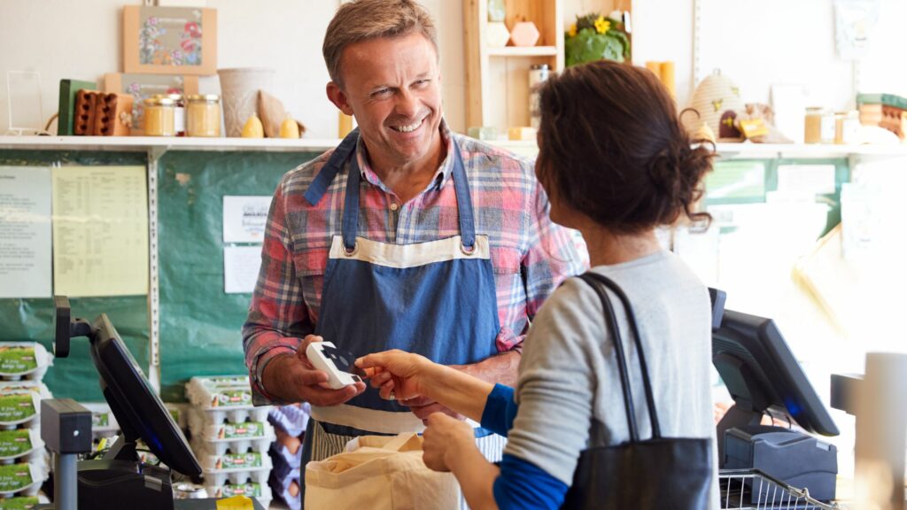 Customer at Checkout of Organic Farm Shop Making Contactless Pay